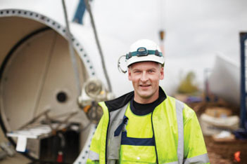 Man in a construction field wearing PPE